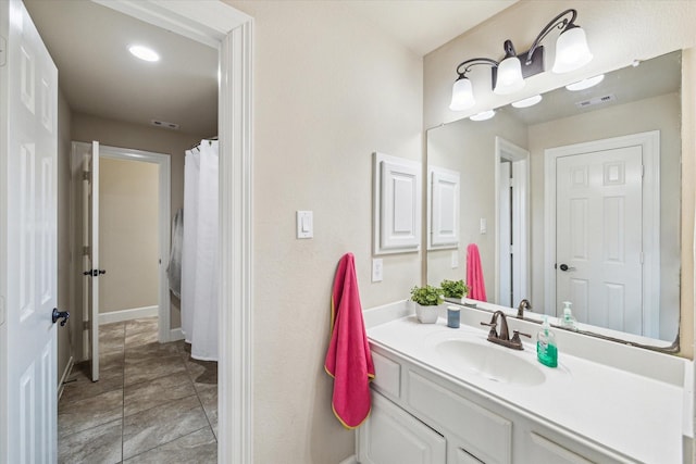 15718 Starcreek Ln, Houston, TX 77044 - bathroom with vanity, baseboards, and recessed lighting