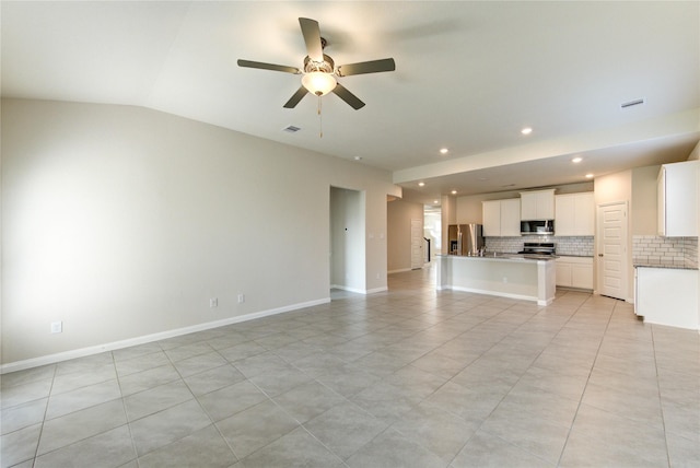 6531 Cody Mountain Trl, Richmond, TX 77407 - unfurnished living room featuring recessed lighting, ceiling fan, vaulted ceiling, baseboards, and light tile patterned floors