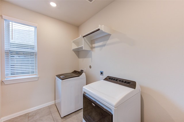 6531 Cody Mountain Trl, Richmond, TX 77407 - laundry area with baseboards, light tile patterned floors, recessed lighting, and washer and clothes dryer
