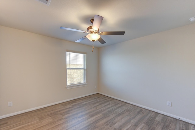 6531 Cody Mountain Trl, Richmond, TX 77407 - unfurnished room featuring wood finished floors, baseboards, a ceiling fan, and a smoke detector