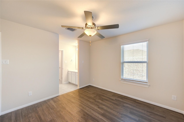 6531 Cody Mountain Trl, Richmond, TX 77407 - empty room with wood finished floors, baseboards, and a ceiling fan