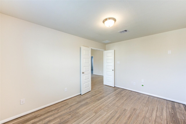 6531 Cody Mountain Trl, Richmond, TX 77407 - empty room with light wood-type flooring and baseboards