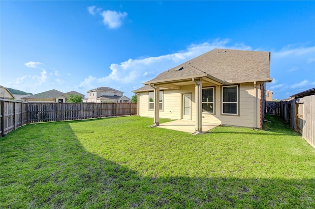 6531 Cody Mountain Trl, Richmond, TX 77407 - rear view of house featuring a patio area and roof with shingles