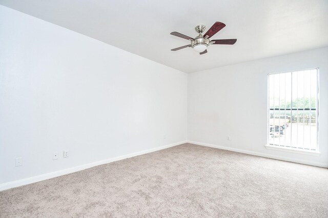 10100 S Gessner Rd Unit 308, Houston, TX 77071 - carpeted empty room featuring baseboards and ceiling fan