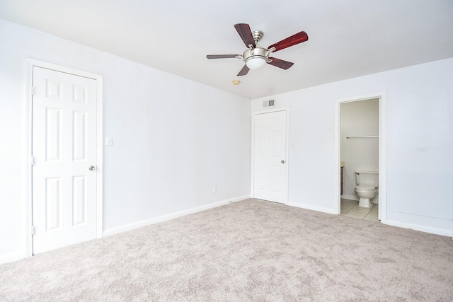 10100 S Gessner Rd Unit 308, Houston, TX 77071 - unfurnished bedroom featuring carpet flooring, baseboards, ensuite bath, and ceiling fan