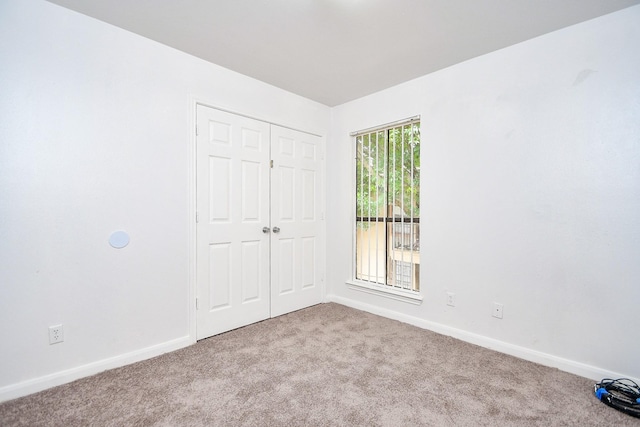 10100 S Gessner Rd Unit 308, Houston, TX 77071 - unfurnished bedroom featuring carpet floors, baseboards, and a closet