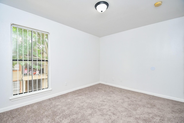 10100 S Gessner Rd Unit 308, Houston, TX 77071 - spare room with carpet, baseboards, and a smoke detector