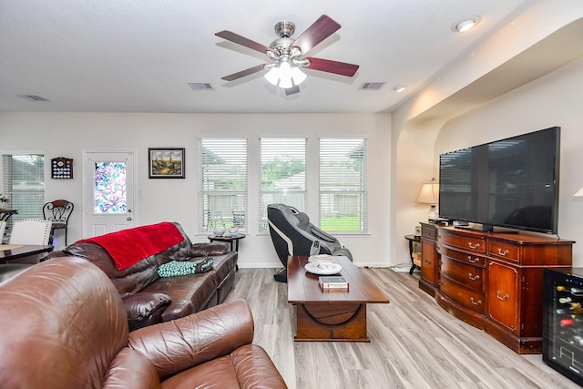 2206 Rocky Hollow Ln, Katy, TX 77450 - living room featuring ceiling fan, light wood-style floors, beverage cooler, and baseboards