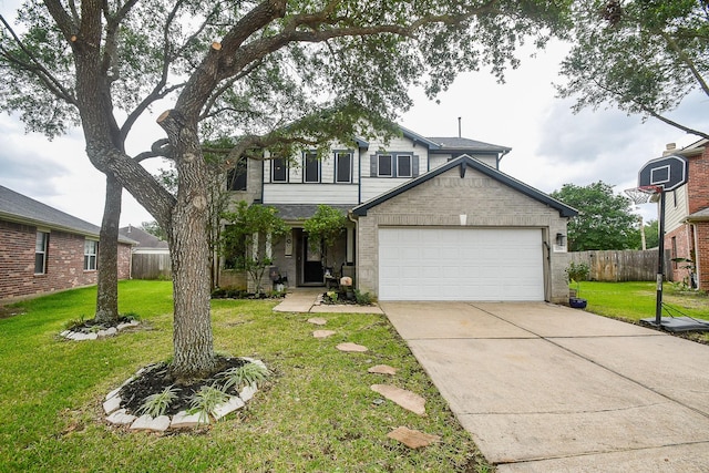 2206 Rocky Hollow Ln, Katy, TX 77450 - traditional-style home featuring an attached garage, driveway, and brick siding