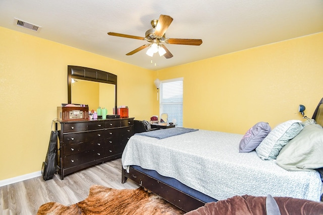 2206 Rocky Hollow Ln, Katy, TX 77450 - bedroom featuring wood finished floors, ceiling fan, and baseboards