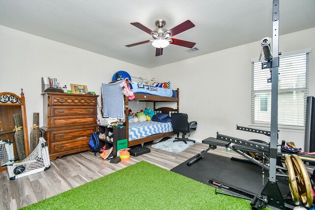 2206 Rocky Hollow Ln, Katy, TX 77450 - bedroom featuring wood finished floors and ceiling fan