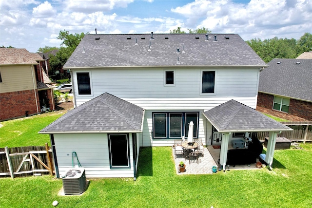 2206 Rocky Hollow Ln, Katy, TX 77450 - back of house featuring cooling unit, a shingled roof, and a patio area