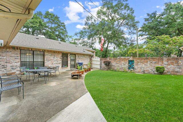 103 Whippoorwill Dr, Livingston, TX 77351 - view of yard with a fire pit and a patio