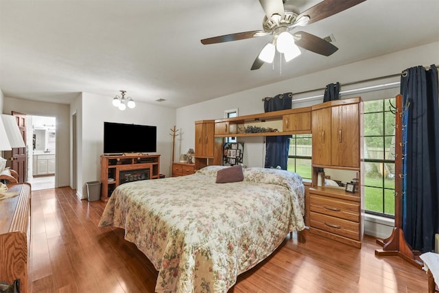 103 Whippoorwill Dr, Livingston, TX 77351 - bedroom with wood finished floors and a chandelier