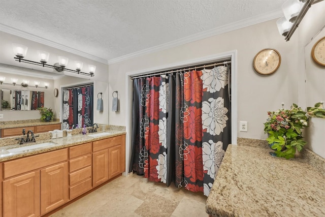 103 Whippoorwill Dr, Livingston, TX 77351 - full bath featuring double vanity, a textured ceiling, and ornamental molding
