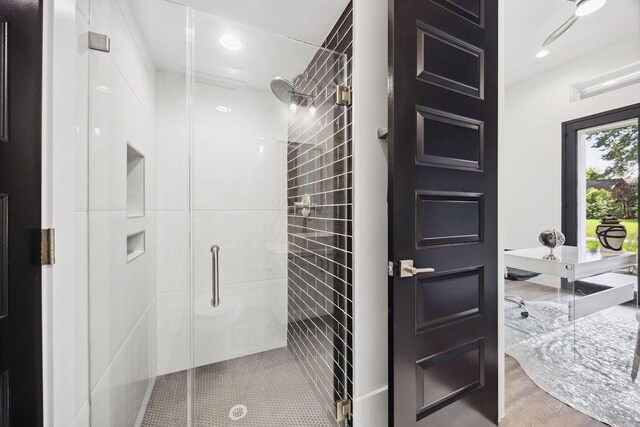 3379 Tampa St, Houston, TX 77021 - bathroom with a stall shower, recessed lighting, and wood finished floors