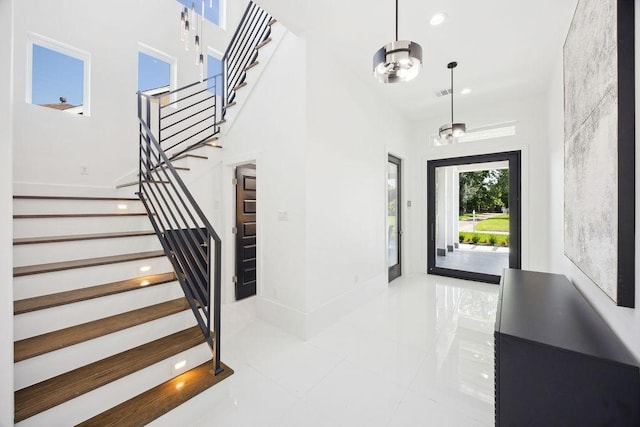 3379 Tampa St, Houston, TX 77021 - stairway featuring tile patterned floors, recessed lighting, and a chandelier