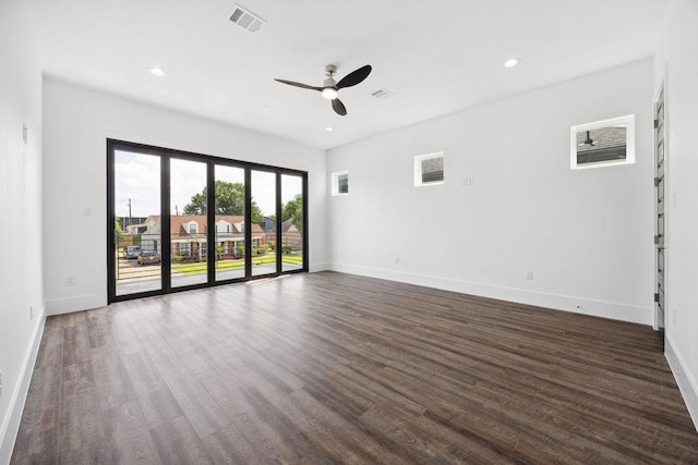 3379 Tampa St, Houston, TX 77021 - unfurnished room featuring a ceiling fan, dark wood-style floors, baseboards, and recessed lighting
