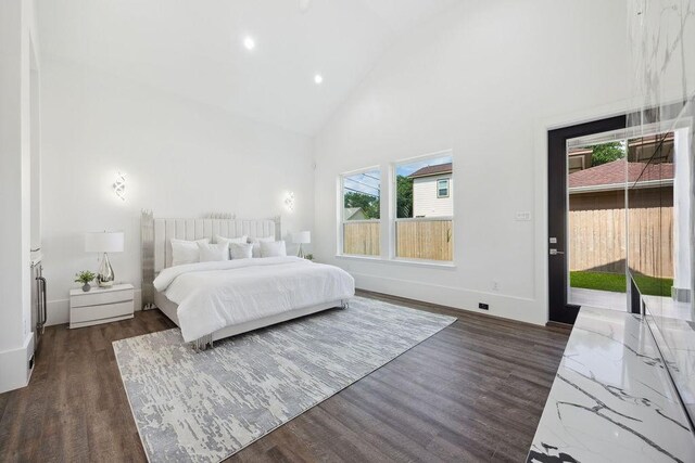 3379 Tampa St, Houston, TX 77021 - bedroom with dark wood-style floors, high vaulted ceiling, recessed lighting, and access to exterior