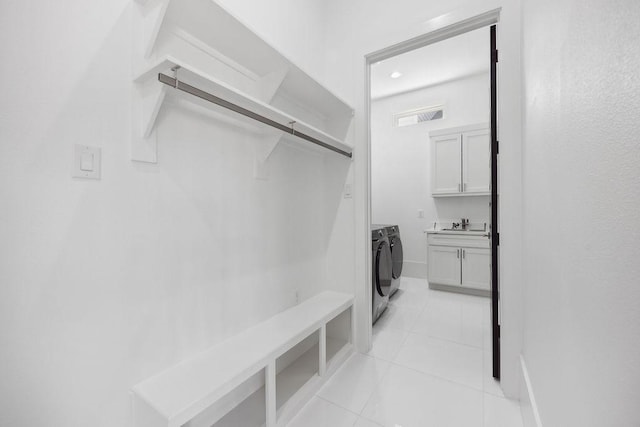 3379 Tampa St, Houston, TX 77021 - mudroom featuring washer and dryer, light tile patterned floors, a sink, and baseboards
