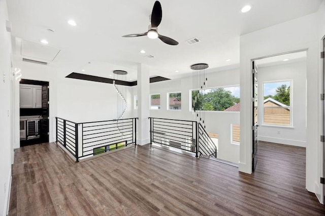 3379 Tampa St, Houston, TX 77021 - spare room with wood finished floors, ceiling fan, baseboards, recessed lighting, and attic access