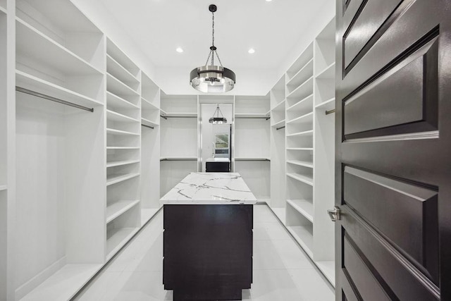 3379 Tampa St, Houston, TX 77021 - walk in closet with light tile patterned floors and a chandelier