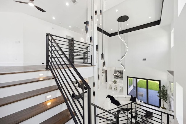 3379 Tampa St, Houston, TX 77021 - staircase featuring a towering ceiling, ceiling fan, and recessed lighting