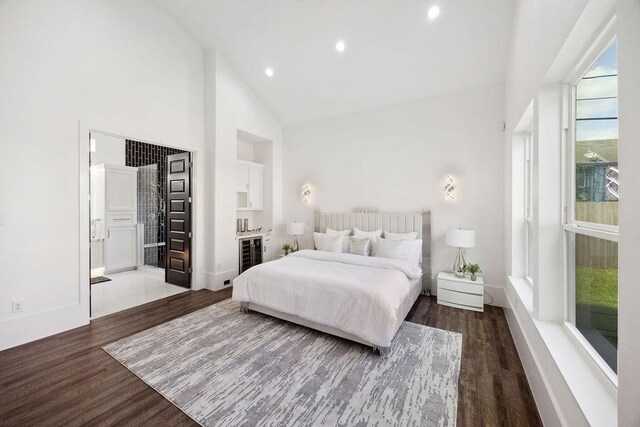 3379 Tampa St, Houston, TX 77021 - bedroom with wood finished floors, high vaulted ceiling, recessed lighting, ensuite bathroom, and baseboards