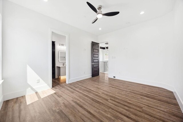 3379 Tampa St, Houston, TX 77021 - unfurnished bedroom featuring wood finished floors, baseboards, recessed lighting, connected bathroom, and ceiling fan