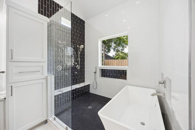 3379 Tampa St, Houston, TX 77021 - bathroom featuring a freestanding tub and a walk in shower