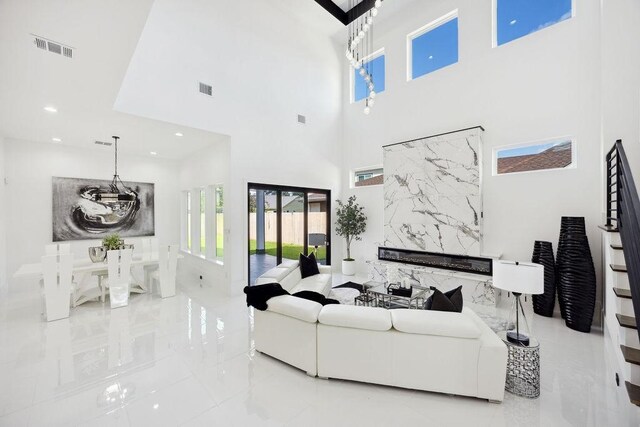 3379 Tampa St, Houston, TX 77021 - tiled living area featuring a towering ceiling and recessed lighting