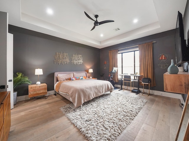407 Graceland St, Houston, TX 77009 - bedroom featuring a raised ceiling, wood finished floors, recessed lighting, baseboards, and a ceiling fan