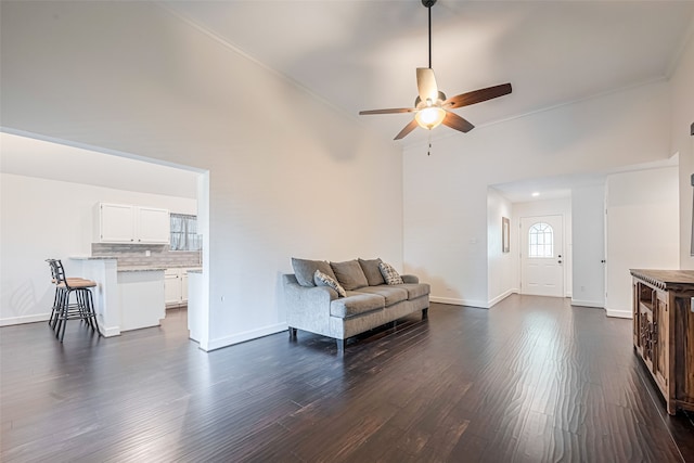 19426 Gladewater Dr, Tomball, TX 77375 - sitting room featuring ceiling fan, baseboards, dark wood-style floors, and ornamental molding
