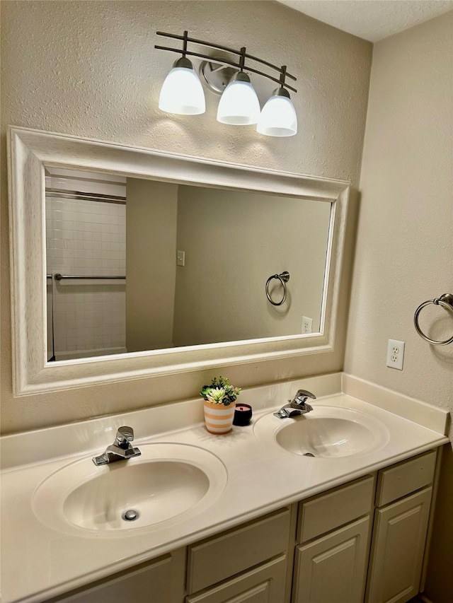 5035 Chappel Hill Dr, Missouri City, TX 77459 - bathroom with double vanity and a textured wall