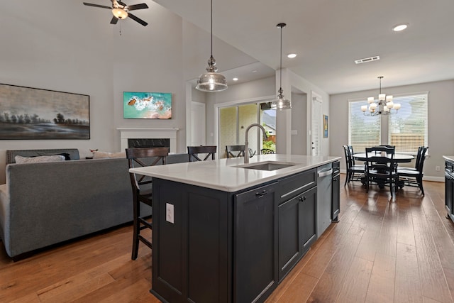 28228 Cedar Peak Dr, Spring, TX 77386 - kitchen with a sink, a high end fireplace, light countertops, open floor plan, and recessed lighting