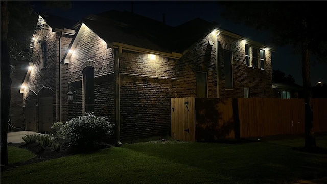 8106 Yarrow Dr, Cypress, TX 77433 - property exterior at twilight with brick siding
