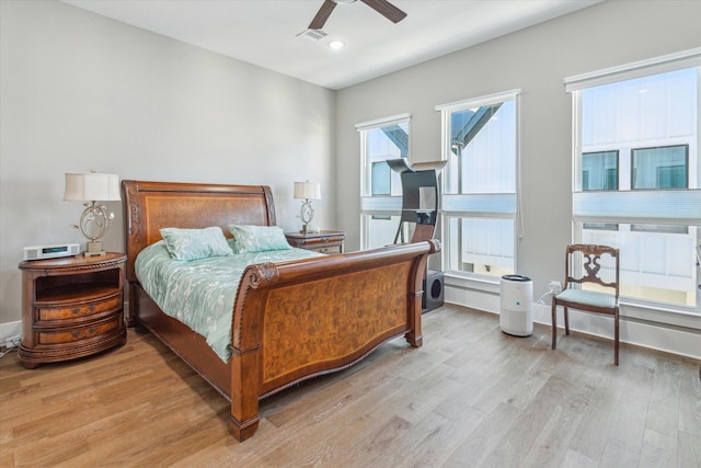 1407 W 23rd St, Houston, TX 77008 - bedroom with light wood-type flooring, recessed lighting, ceiling fan, and baseboards