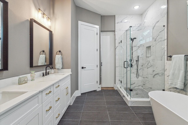 1407 W 23rd St, Houston, TX 77008 - full bath featuring a freestanding tub, a marble finish shower, double vanity, tile patterned floors, and recessed lighting
