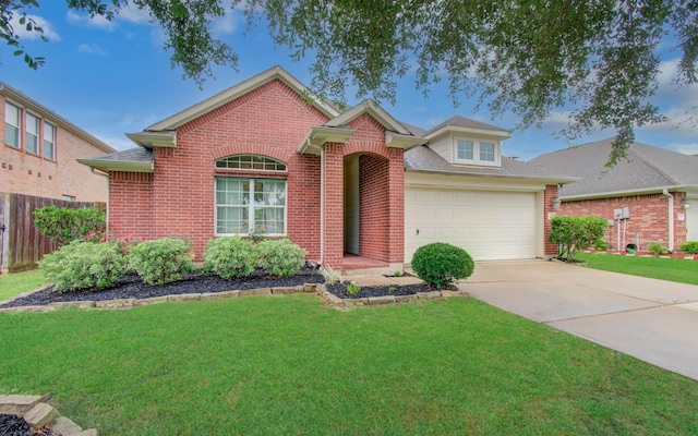 1918 Hollow Mist Ln, Pearland, TX 77581 - traditional-style house featuring brick siding, a garage, and concrete driveway