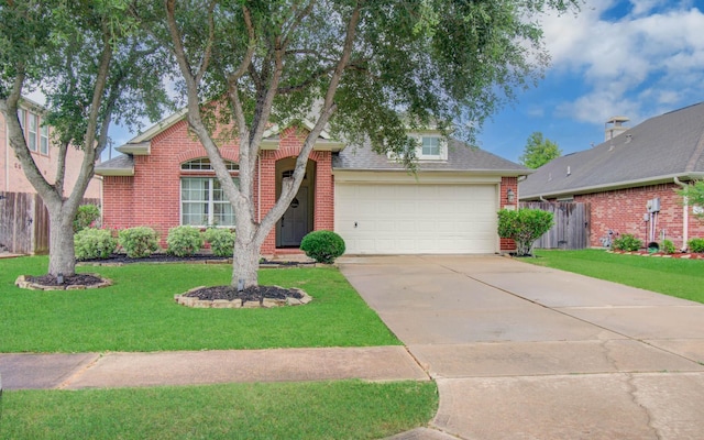 1918 Hollow Mist Ln, Pearland, TX 77581 - view of front facade with brick siding, an attached garage, driveway, and a shingled roof
