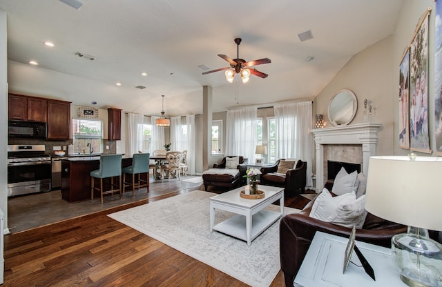 1918 Hollow Mist Ln, Pearland, TX 77581 - living area with dark wood-type flooring, healthy amount of natural light, a ceiling fan, vaulted ceiling, and recessed lighting
