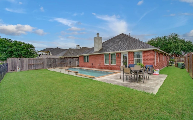 1918 Hollow Mist Ln, Pearland, TX 77581 - rear view of property with a chimney, a shingled roof, brick siding, and a patio