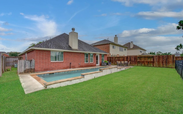 1918 Hollow Mist Ln, Pearland, TX 77581 - back of property featuring brick siding, roof with shingles, and a chimney
