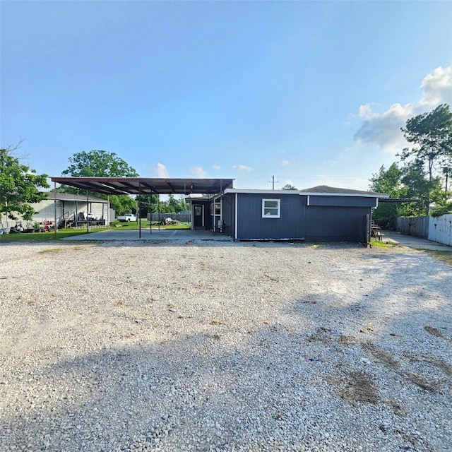 19207 Fm 2100th Rd, Crosby, TX 77532 - view of front facade featuring a carport and gravel driveway