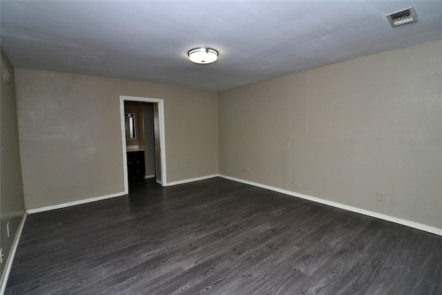 19207 Fm 2100th Rd, Crosby, TX 77532 - unfurnished room with dark wood finished floors and baseboards