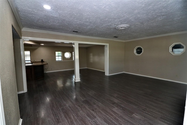 19207 Fm 2100th Rd, Crosby, TX 77532 - unfurnished living room featuring dark wood-style floors, baseboards, a textured ceiling, and ornamental molding