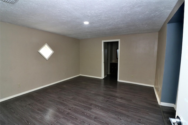 19207 Fm 2100th Rd, Crosby, TX 77532 - unfurnished room with a textured ceiling, baseboards, dark wood-style floors, and recessed lighting