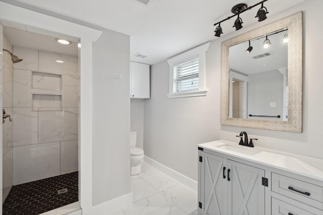 2604 Cochran St, Houston, TX 77009 - full bath with baseboards, marble finish floors, vanity, and tiled shower
