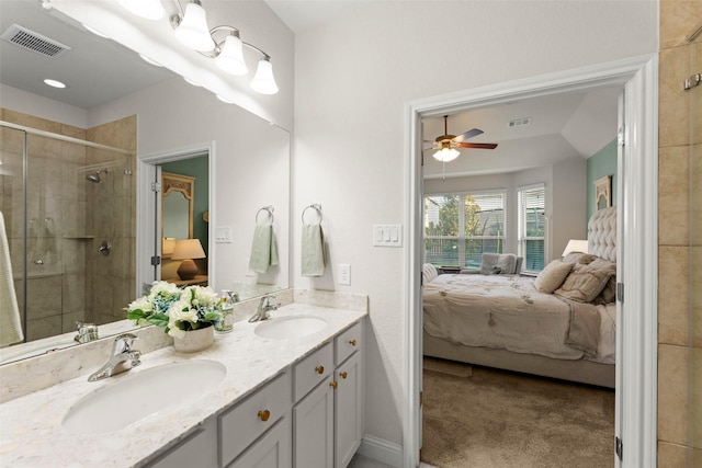 18731 Pilot Knolls Dr, Cypress, TX 77433 - ensuite bathroom featuring double vanity, a shower stall, and ceiling fan