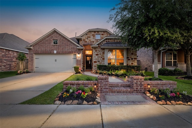 18731 Pilot Knolls Dr, Cypress, TX 77433 - view of front of house with an attached garage, stone siding, and driveway